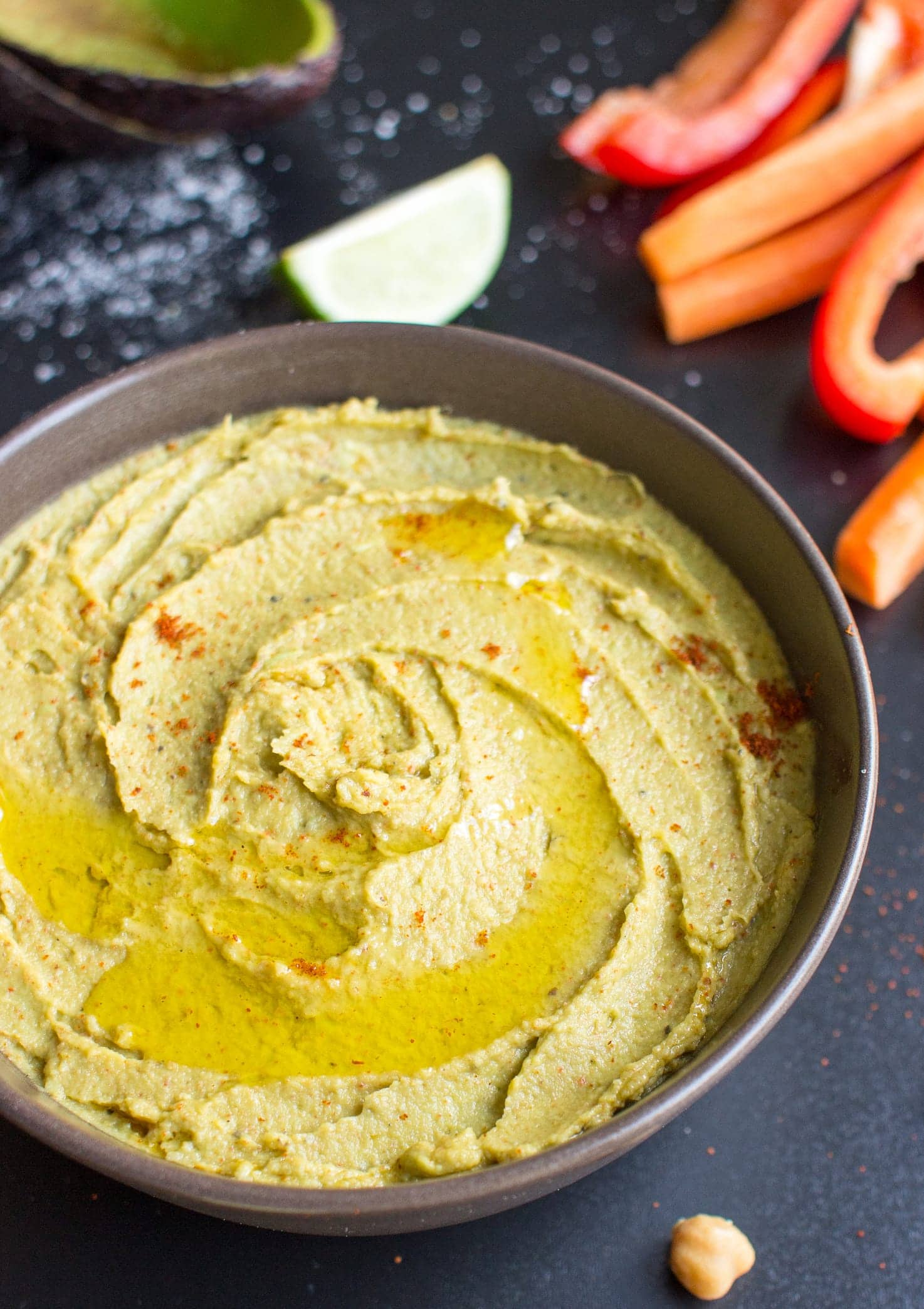 Avocado Hummus is ready in a bowl alongside the veggie sticks | Hurry The Food Up