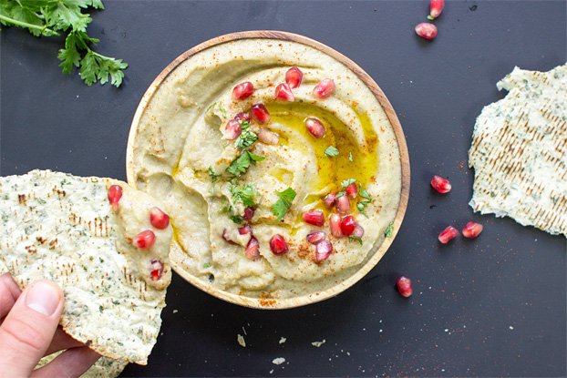 Dipping bread into a bowl of Baba Ghanoush | Hurry The Food Up
