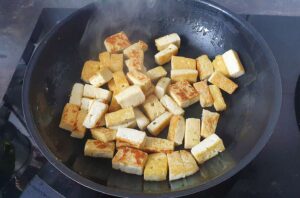 Tofu cubes are frying in the pan | Hurry The Food Up