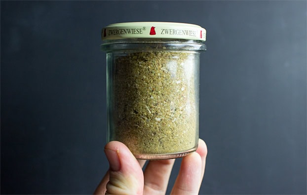 The closed jar with seasoning is in the hand | Hurry The Food Up