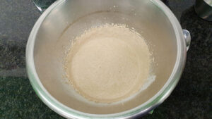 The mix of yeast, water and flour is blended in the mixing bowl #dried Italian herbs #mozzarella | 