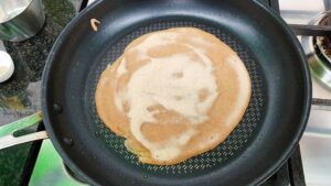 The dough is frying in the pan #olives #basil leaves | 