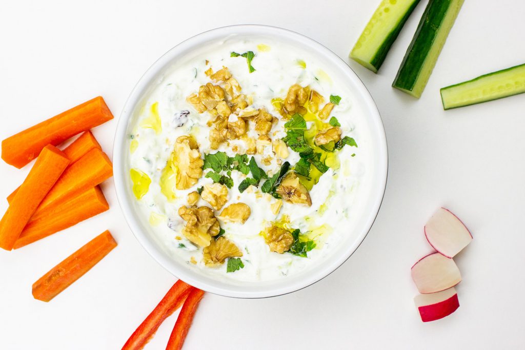 Persian Cucumber Dip is ready on the table in a bowl with chopped veggies #cucumber #mint | 