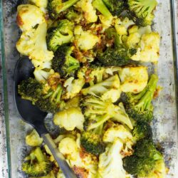 Roasted Broccoli and Cauliflower is spread unto a baking sheet in a single layer | Hurry The Food Up
