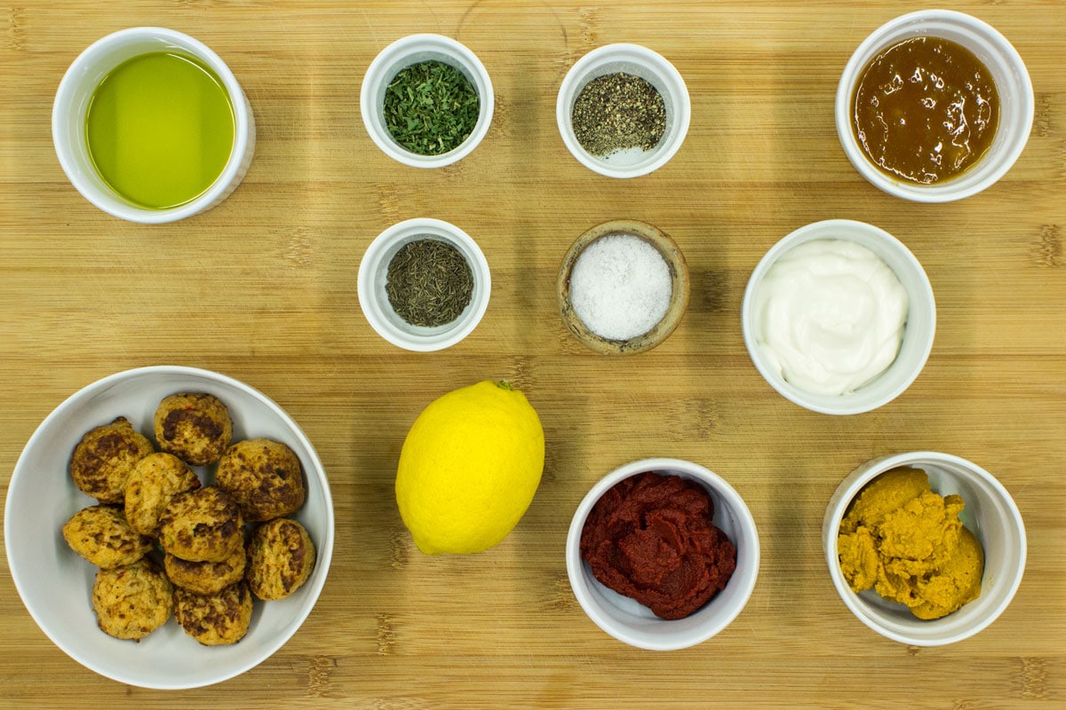 Vegetarian coronation chicken ingredients like veggie ‘meat’, olive oil, curry paste, mayonnaise, lemon, tomato puree, spices, etc | Hurry The Food Up