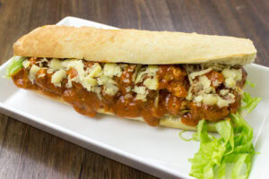 The white ectangular plate with vegetarian coronation chicken | Hurry The Food Up