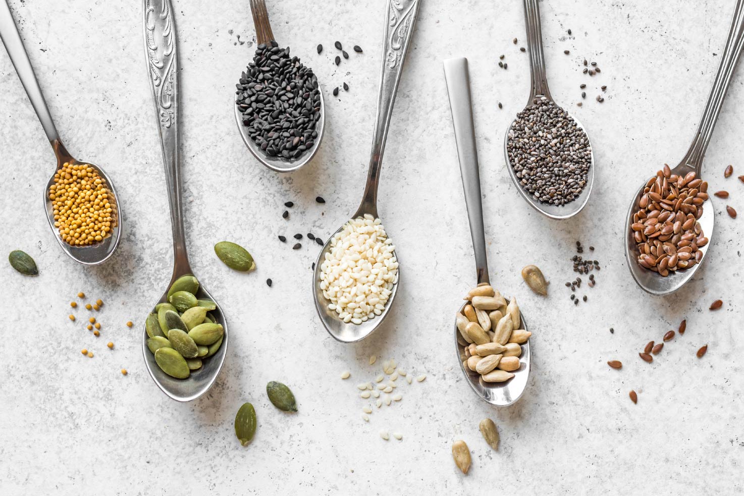 Various seeds assortment on the teaspoons | Hurry The Food Up