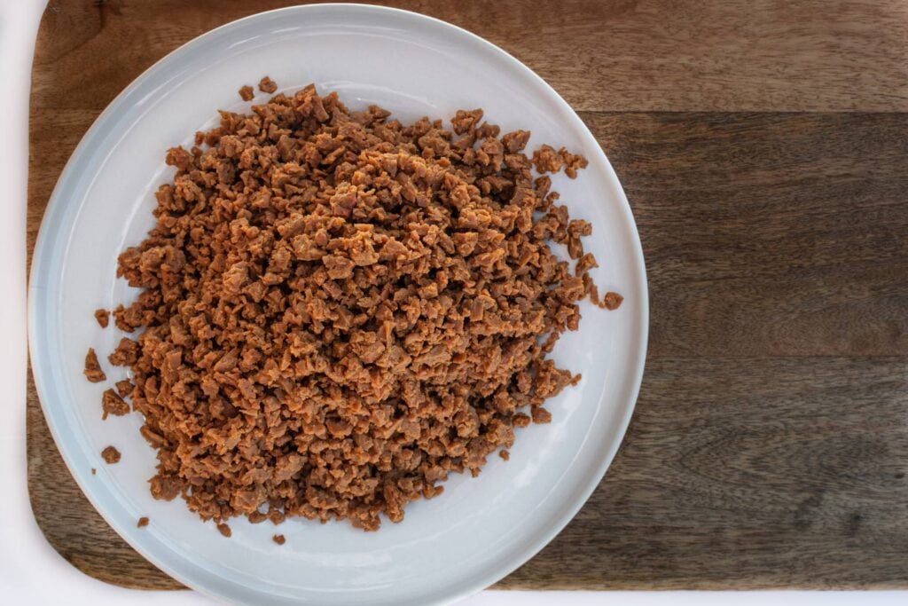 Seitan product is on the plate that is on the chopping board | Hurry The Food Up