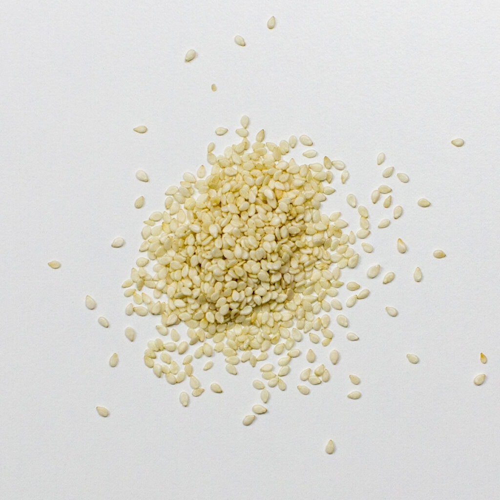 Sesame seeds on white background
