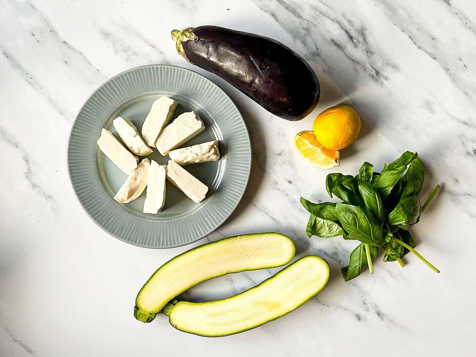 The ingredients are on the table - halloumi, courgette, aubergine, lemon and basil #salt #pepper | 