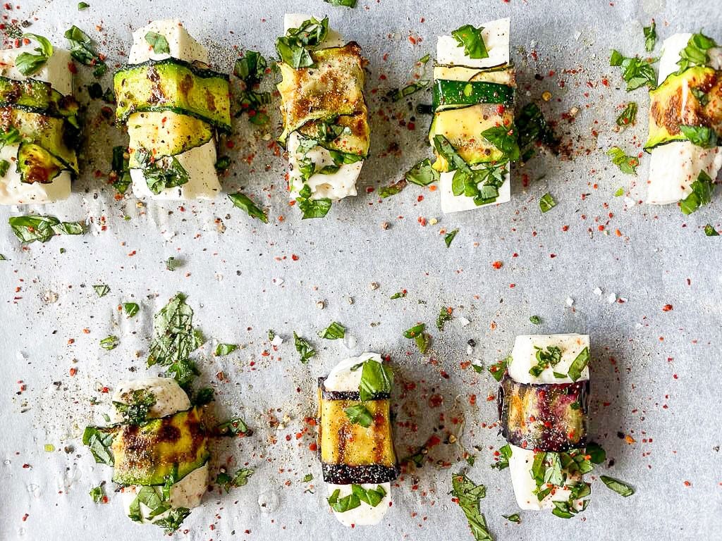 The halloumi pigs in blankets are placed on a baking tray #halloumi #courgette | 