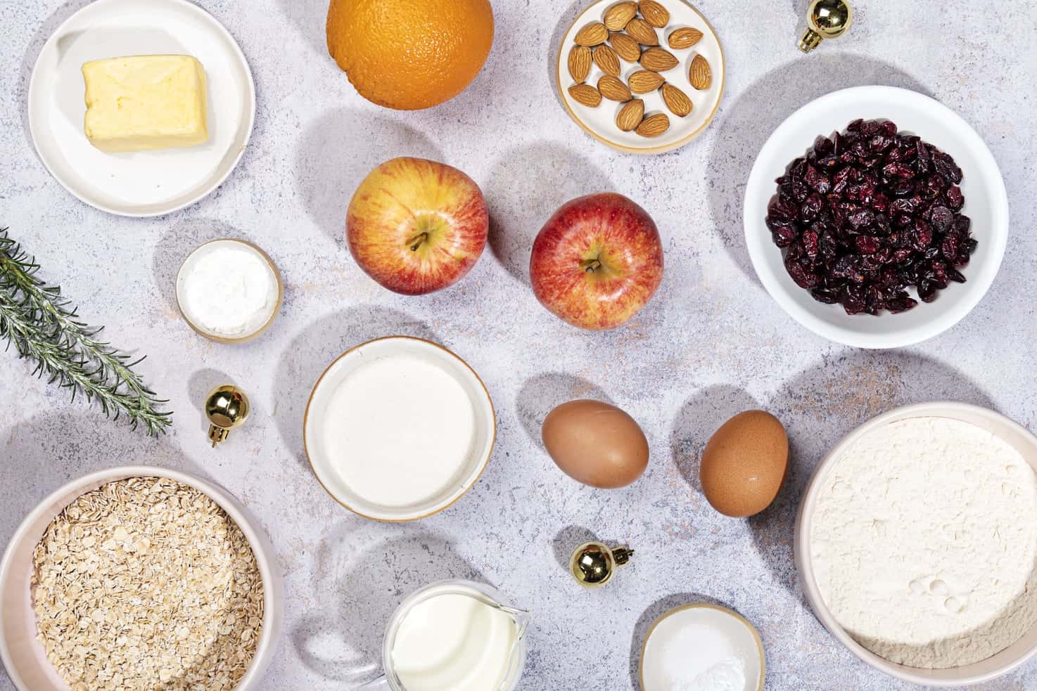 The ingredients for the apple breakfast bake, including apples, an orange and cranberries. | Hurry The Food Up