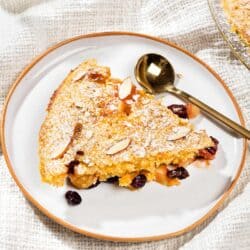A slice of apple breakfast bake alongside a glass of milk. | Hurry The Food Up