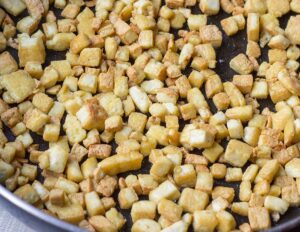 Tofu cubes start crispening up | Hurry The Food Up