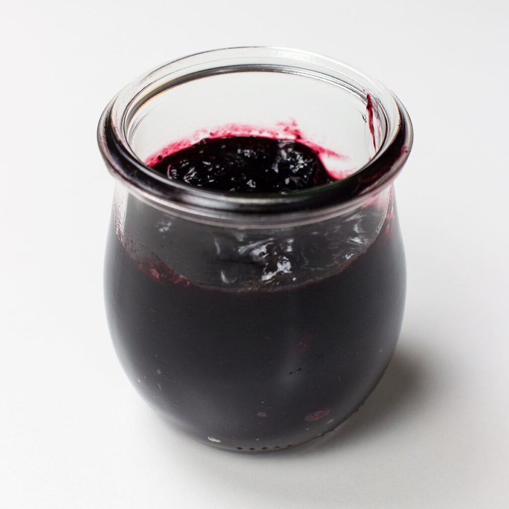 Blueberry jam on white background