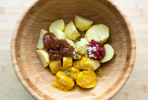 Irish Bombay Potatoes - The Best Curried Potatoes in the World - mix all ingredients into large bowl #vegan #spiced | 