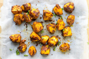 Irish Bombay Potatoes - The Best Curried Potatoes in the World - layer the potatoes over a large oven tray #herbs #indian | 