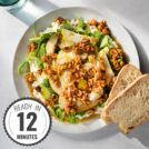 Bird's-eye view of cottage cheese salad and two pieces of bread served on a white plate which is on a light surface with a time badge in the bottom left corner | Hurry The Food Up