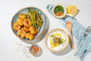 The process of serving with feta dipping sauce, smashed potatoes and green beans | Hurry The Food Up