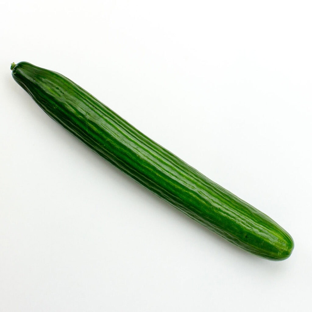 A cucumber on white surface