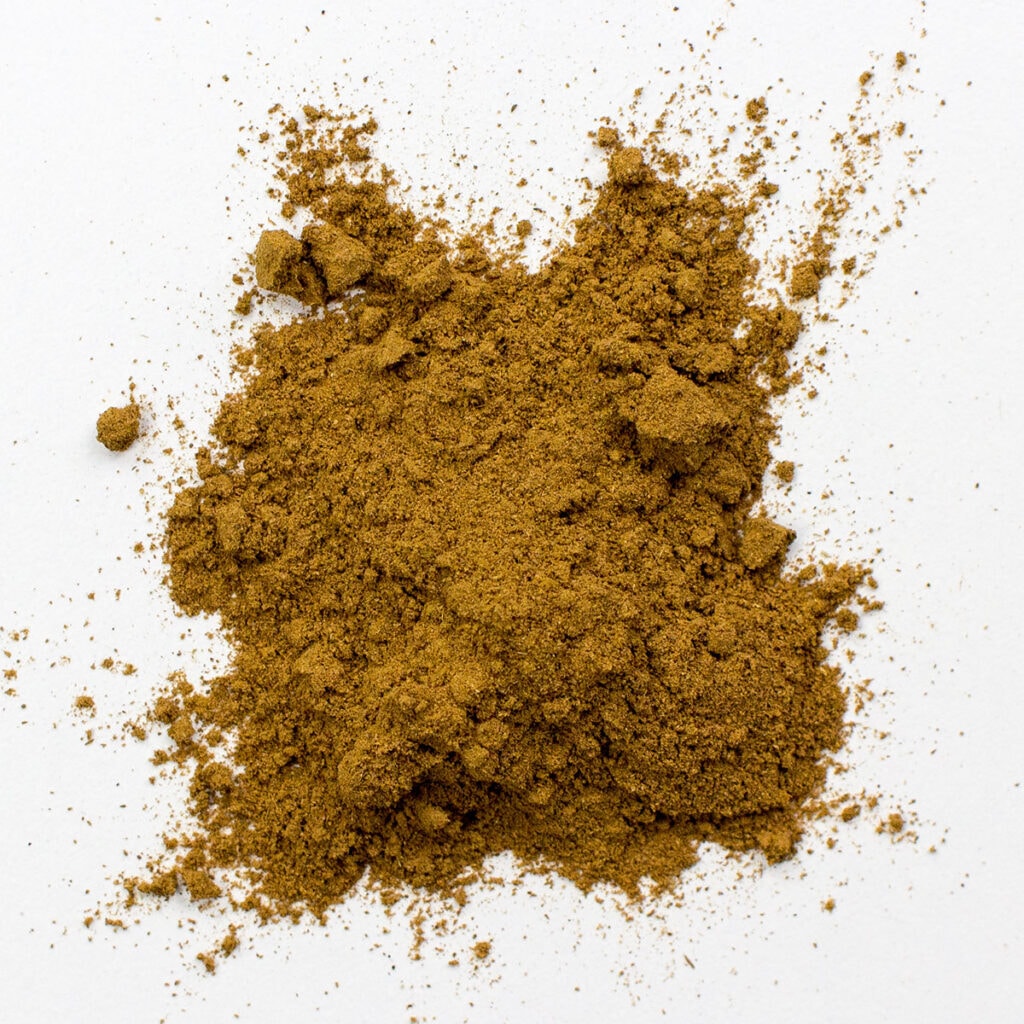 Cumin on white surface