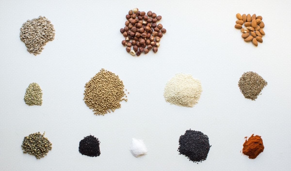 Seeds, whole spices and ground spices are laid out in piles | Hurry The Food Up