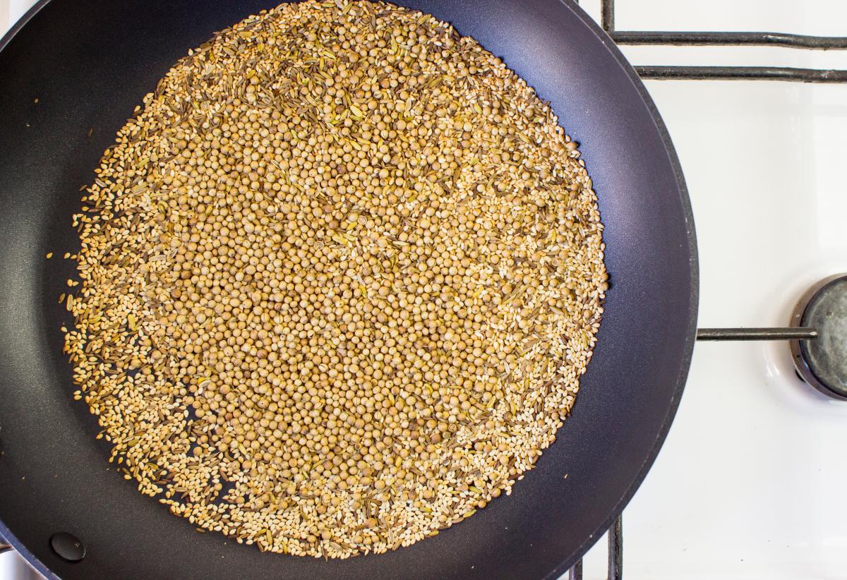 Whole spices in a frying pan being toasted gently | Hurry The Food Up