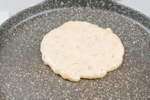 The process of pouring batter onto the pan to make pancake shapes | Hurry The Food Up