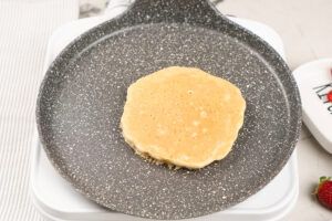 The process of cooking protein pancakes until golden brown on each side | Hurry The Food Up
