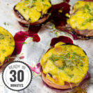 Grilled cherry tomatoes topped with melted yellow cheese and microgreens, served on a foil-lined baking tray with drizzles of savory blueberry jam with a timestamp in the left corner.