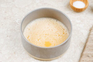 The process of whiping eggs until egg whites and yolks are completely incorporated homogeneously | Hurry The Food Up