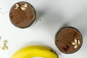 Two glasses of cashew milkshake with a banana | Hurry The Food Up