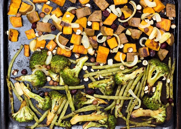 Sweet potato cubes, broccoli, onion, green peas and hazelnuts are baked on the tray | Hurry The Food Up