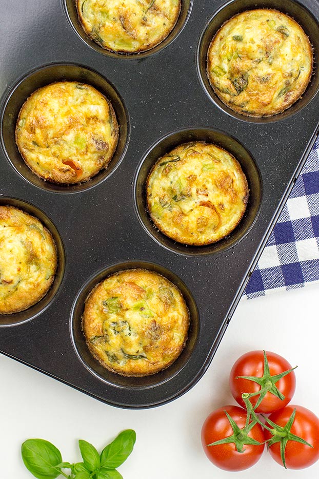 Italian-Style Breakfast Egg Muffins - Italian-Style Breakfast Egg muffins are baked in muffin slots #olive oil #basil | 