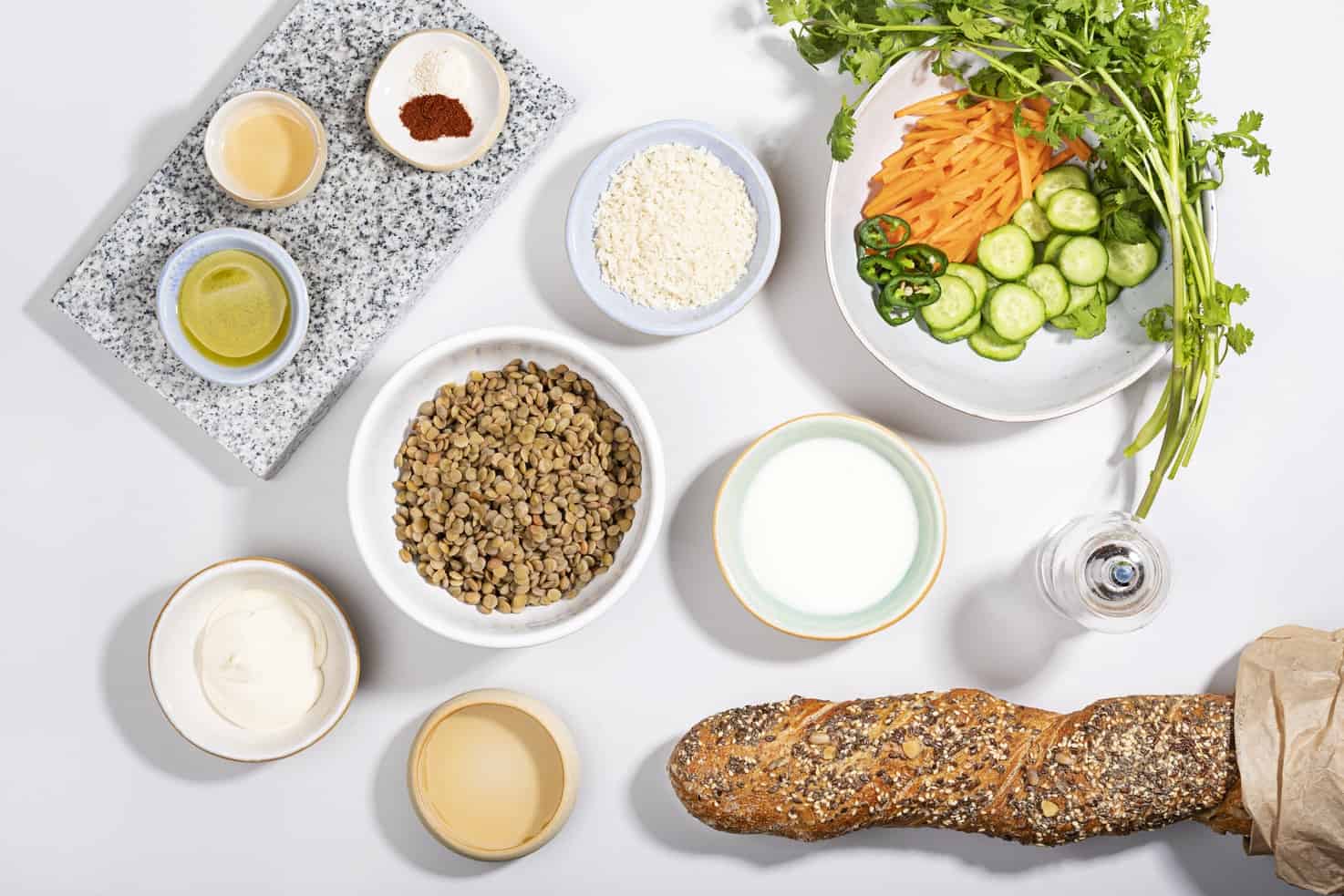 The ingredients for a lentil banh mi are laid out including bread, lentils and vegetables | Hurry The Food Up