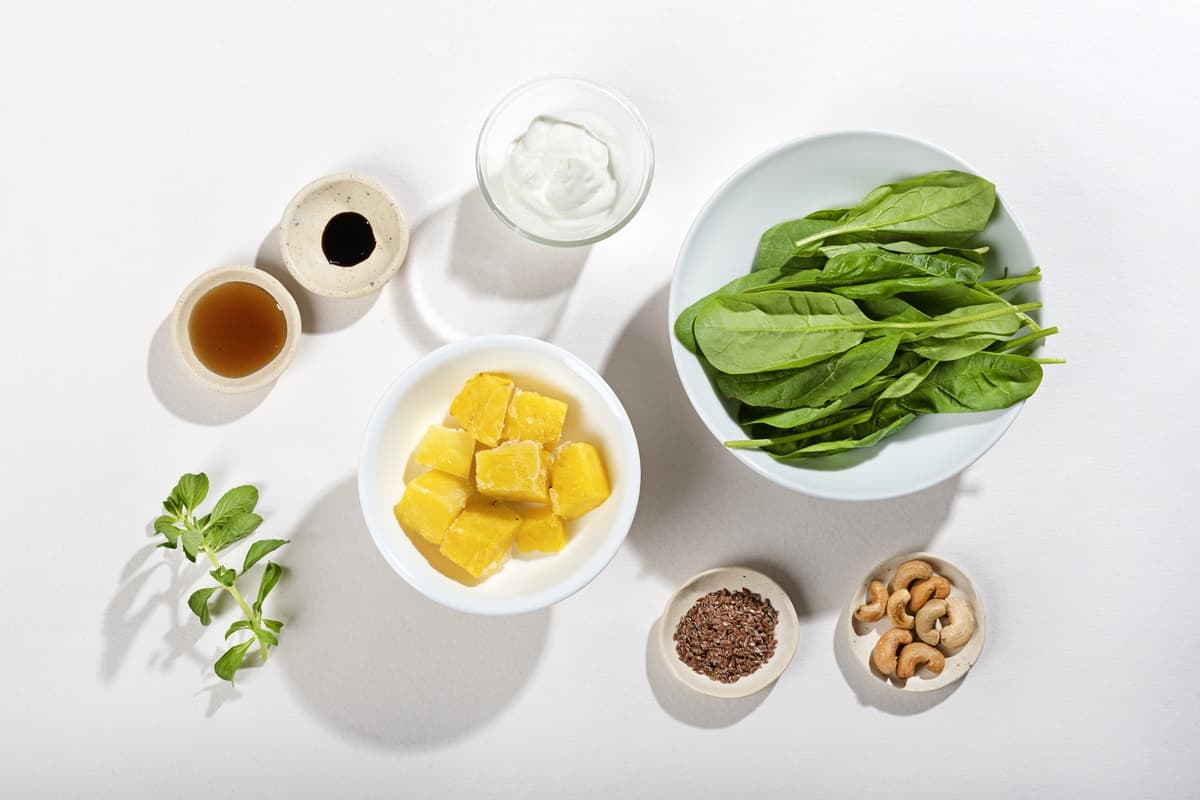 Ingredients for a smoothie including pineapple, spinach, yogurt, flax seeds, cashews & mint leaves | Hurry The Food Up