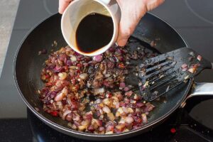 Red Onion Chutney - Sweet and Sour gives us Power - onions are cooking in the large pan #garlic #appetizer | 
