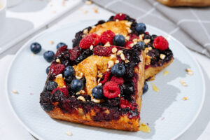 A nice white plate with French toast is on a light surface | Hurry The Food Up