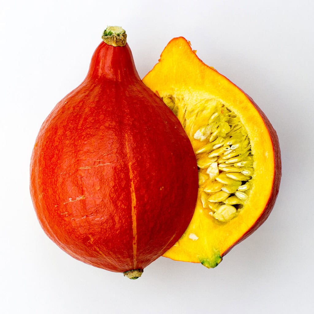 Two pumpkin halves on white background