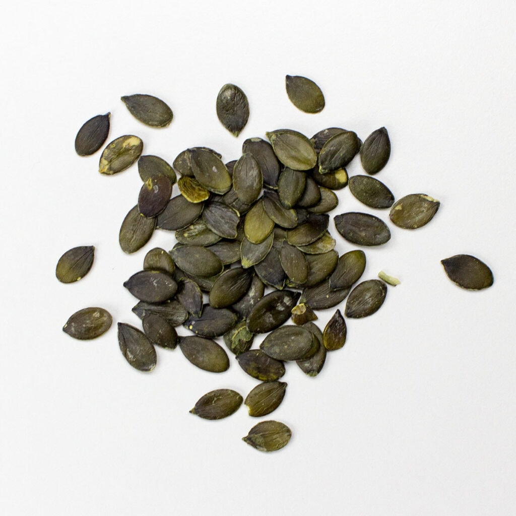 Pumpkin seeds on white background