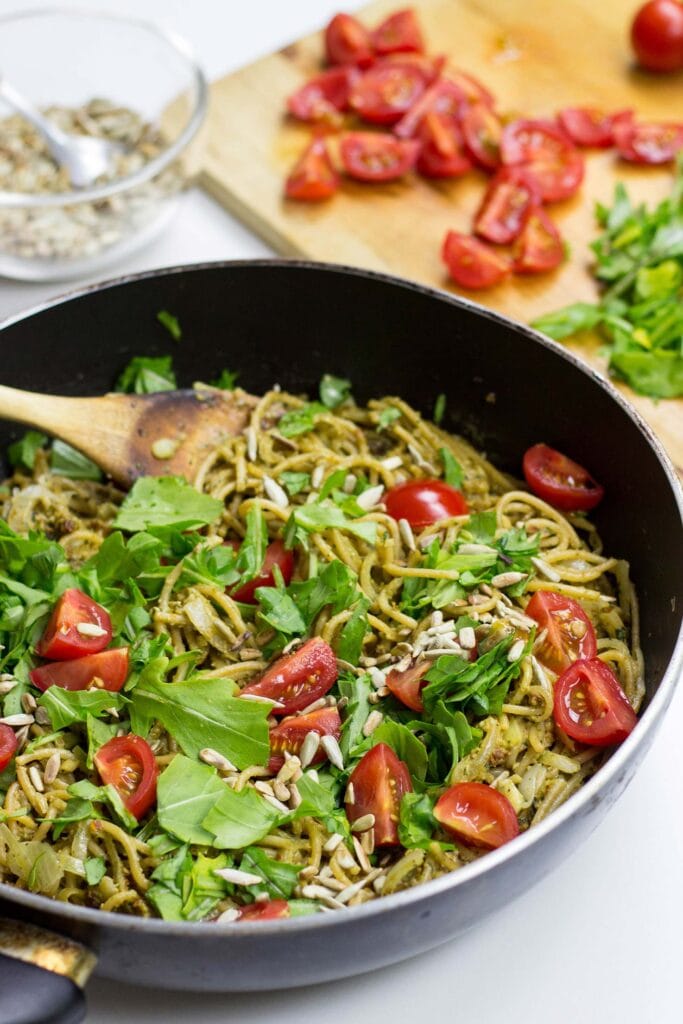 Red Pesto Pasta is in the pan wooden spoon | Hurry The Food Up