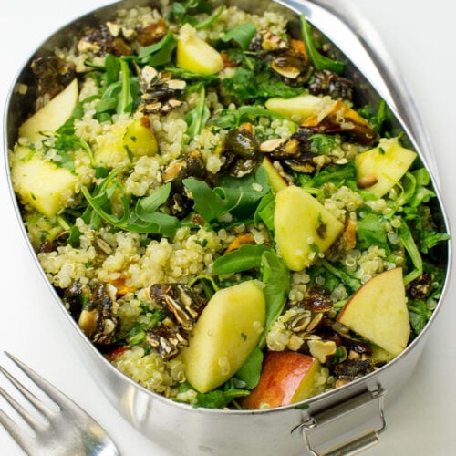 A metal bowl of Roasted Pumpkin Quinoa Salad with Rocket Pesto