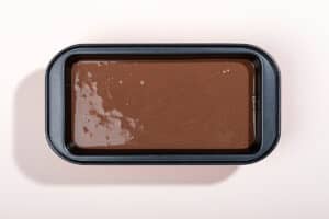 Prepared ice cream is placed to the black container for freezing | Hurry The Food Up