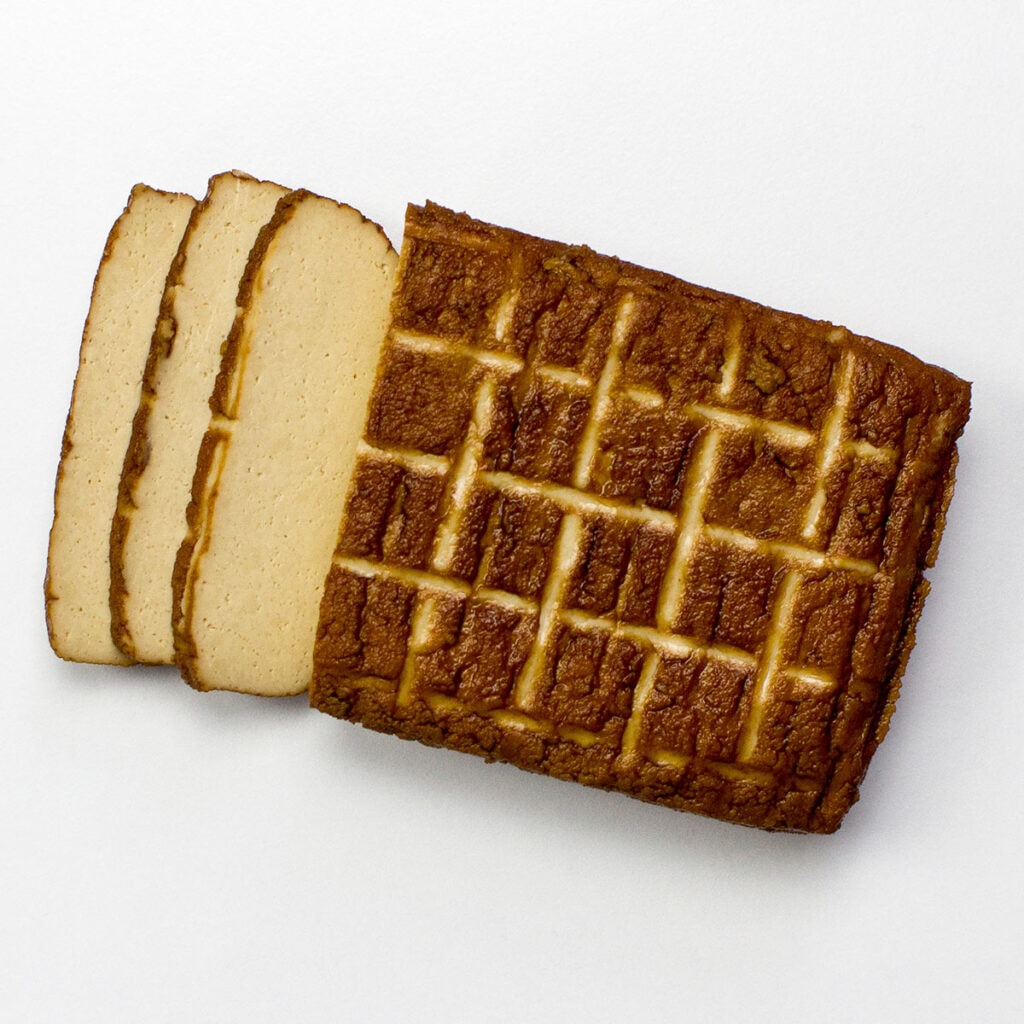 Smoked tofu on white surface