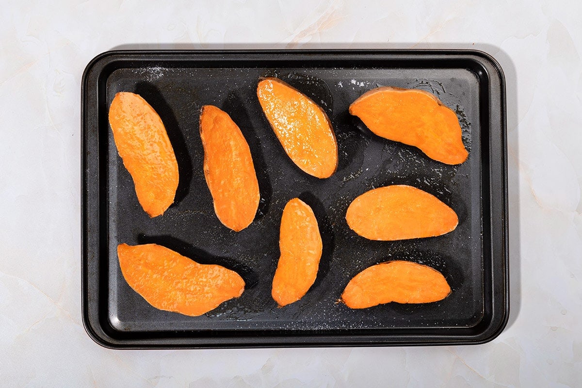 Slices of sweet potatoes are laid on the tray for baking | Hurry The Food Up