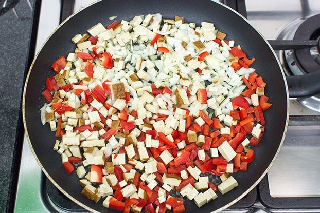 Tofu, onion and pepper are frying in the pan #onion #vegetarian | 