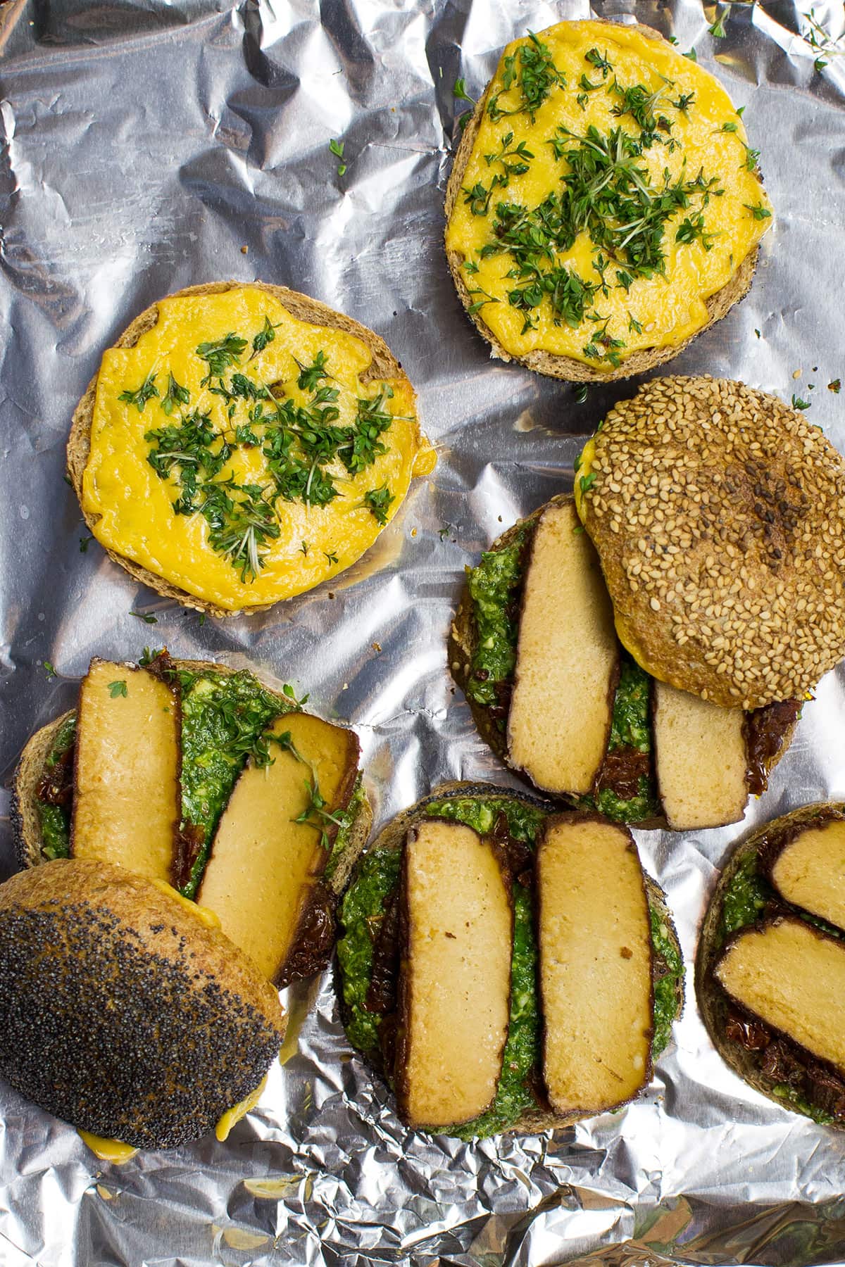 A Tofu Pesto Sandwich ingredients on a baking sheet.