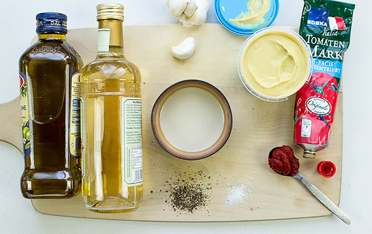Homemade caesar dressing ingredients on the cutting board | Hurry The food Up