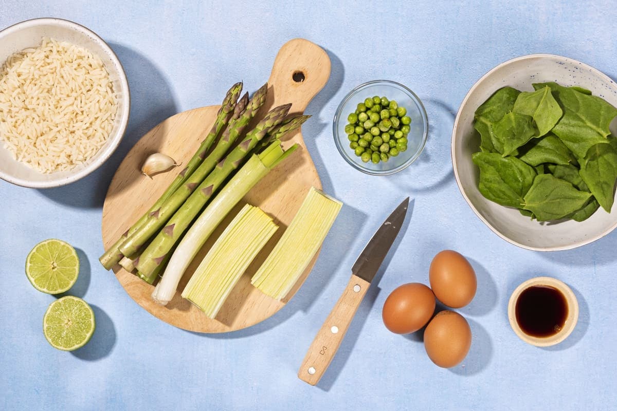 Ingredients for the rice dish, including rice, asparagus, leek, peas, eggs, spinach, lime, soy sauce | Hurry The Food Up