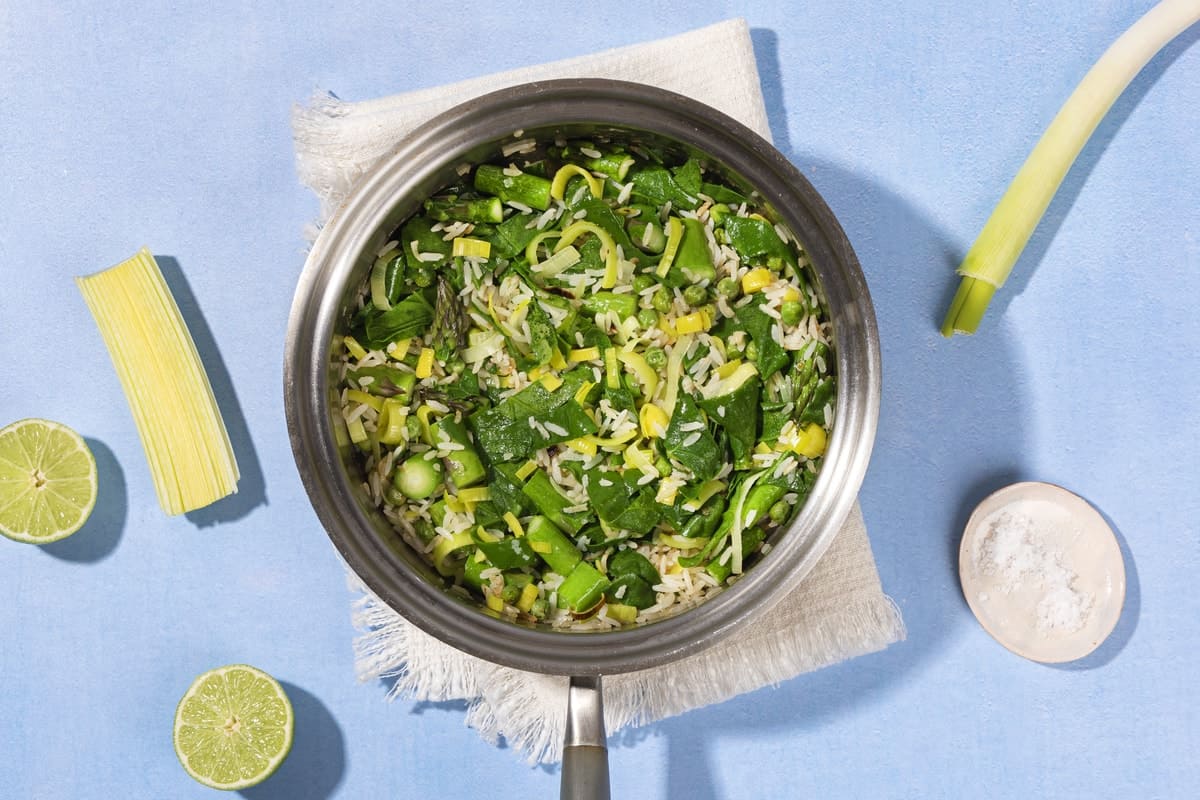A pan filled with chopped vegetables and rice, placed on a folded tea towel, with a tray of salt beside | Hurry The Food Up